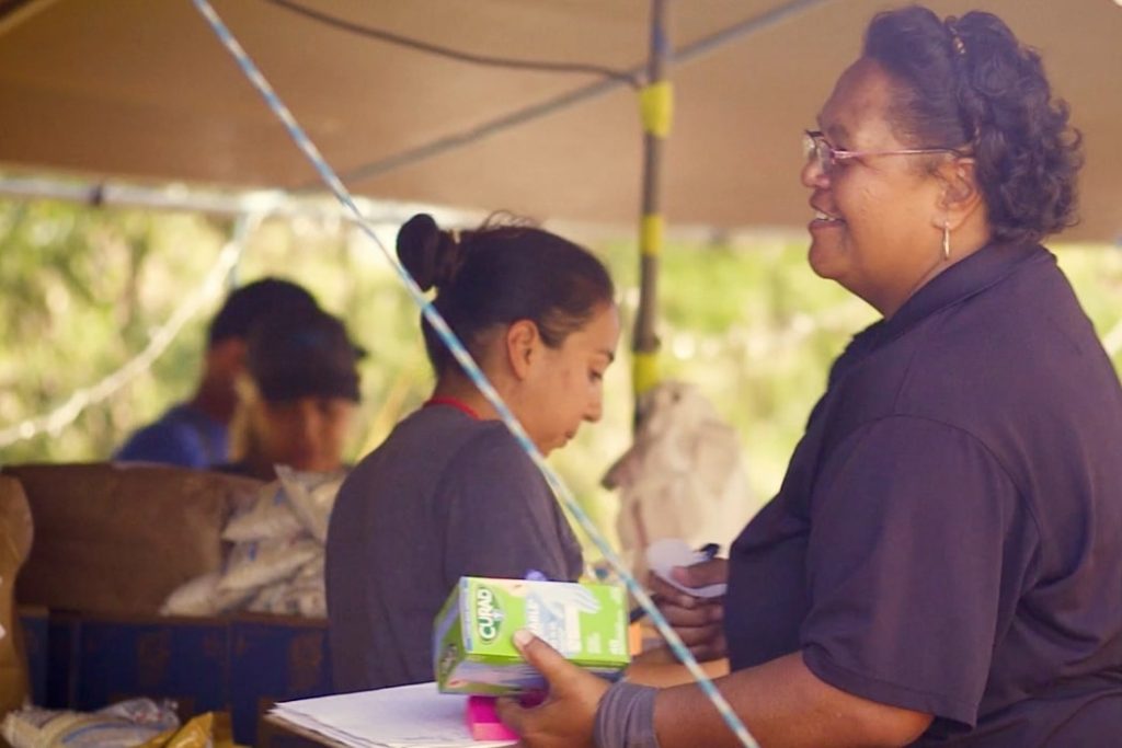 Woman handing out food