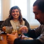 Woman smiling at dining table