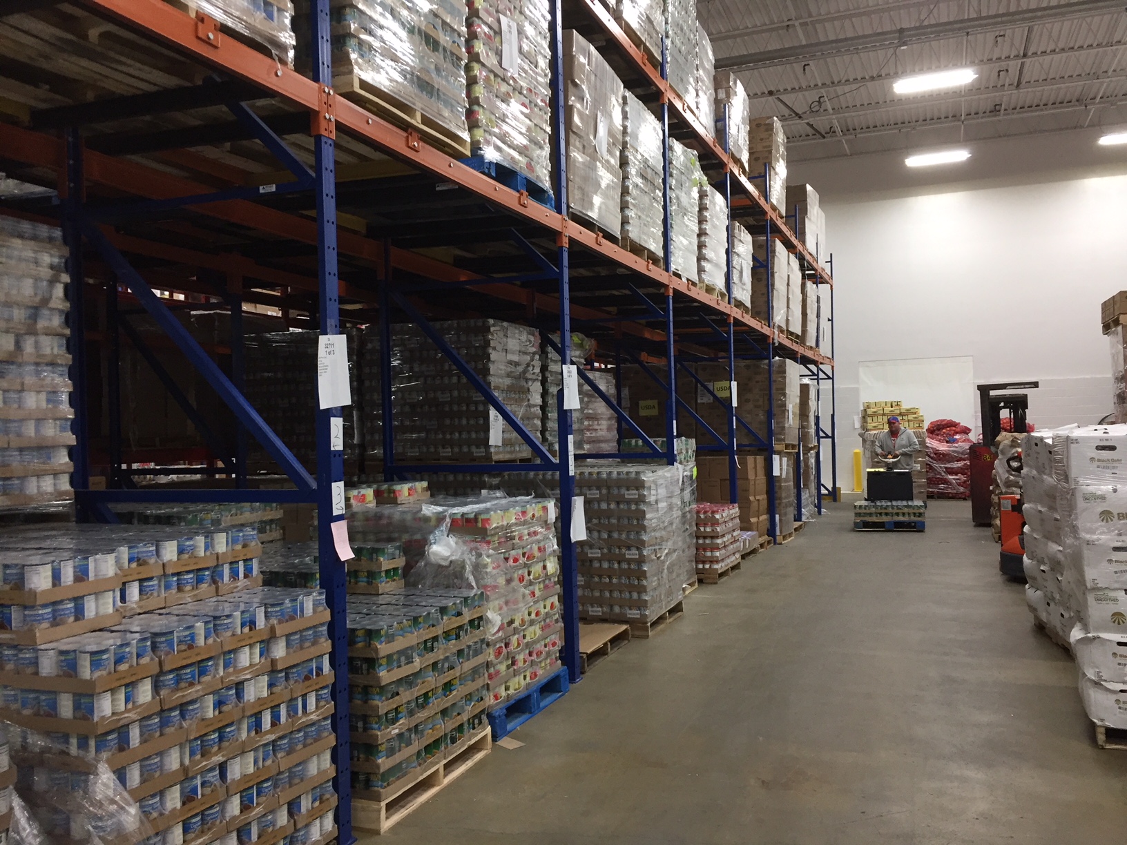 Tall racking with pallets of packaged food