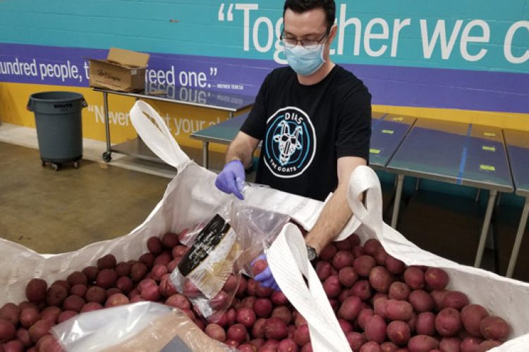 Volunteer packing potatoes