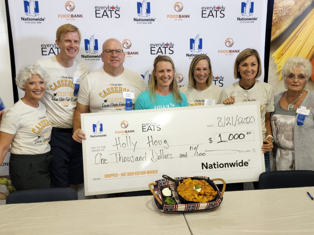 State fair casserole contest winner Holly Houg, center, poses with judges.