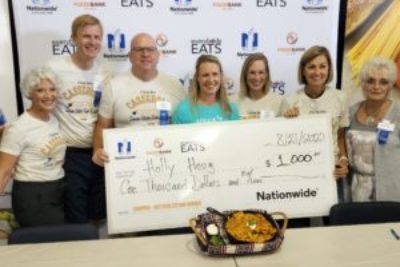 Winner of Food Bank of Iowa's 2022 Chopped casserole contest at Iowa State Fair with judges