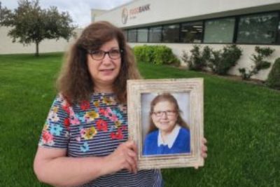 Brenda holds a photo of her sister Pat.