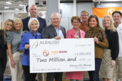 Michelle Book accepts check on behalf of Dennis Albaugh family and Albaugh LLC