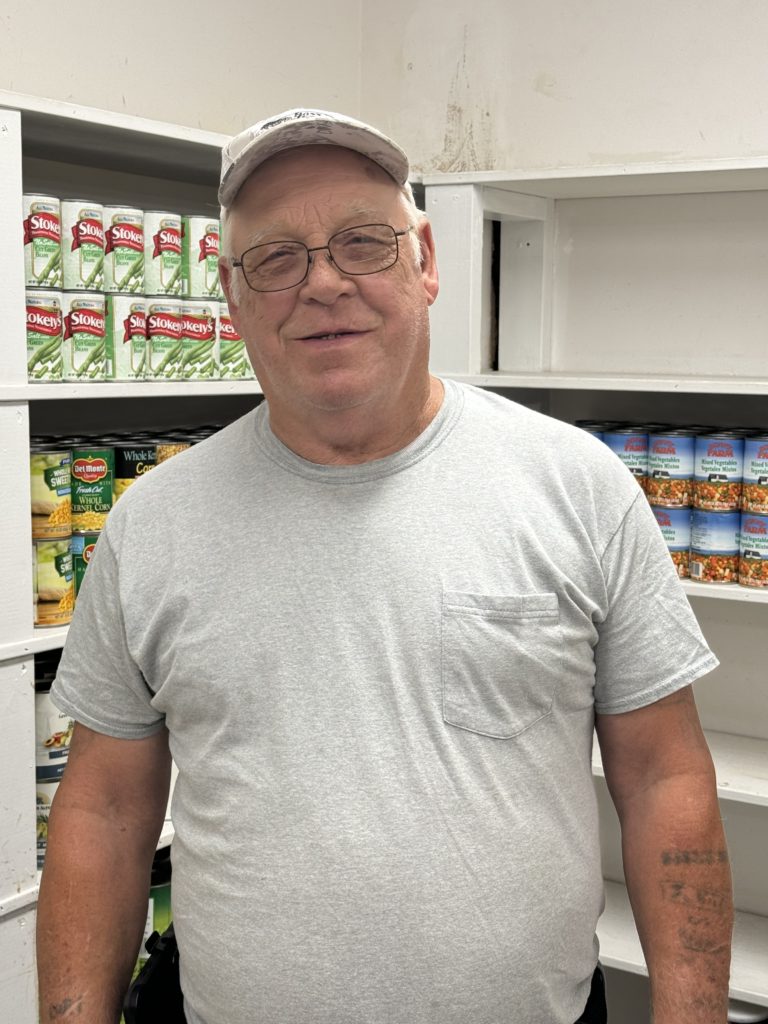 John standing in pantry